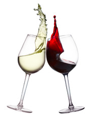 Two wine glasses with splashing of red and white wine isolated on white background, wine tasting...