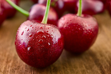 Close up of fresh cherry berries with water drops.