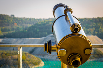 Telescope with the Marl quarry Maastricht ENCI in the background