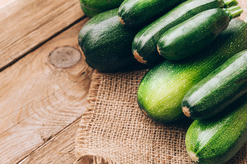 Fresh farmer organic zucchini on a wooden background