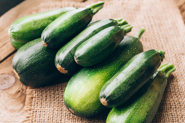 Fresh farmer organic zucchini on a wooden background