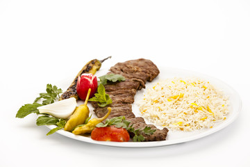 Closeup On Grilled Lamb Kebab With Rice