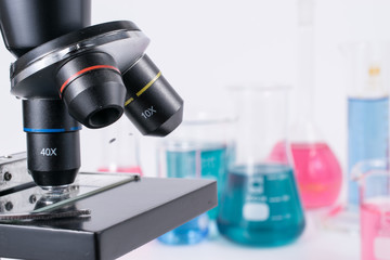 laboratory beakers and microscope 