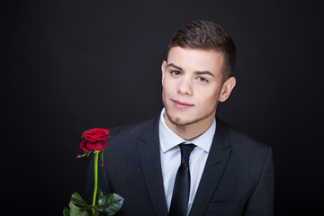 man with red rose