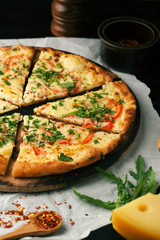 Delicious pizza margherita with arugula and basil