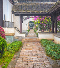 Scenery of Chinese garden with round gate hole