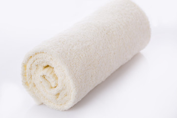 White towel roll on white background