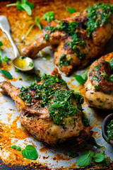 Chicken a grill with chimichury sauce.