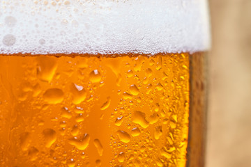 Close up of cold beer in a glass. Beer background
