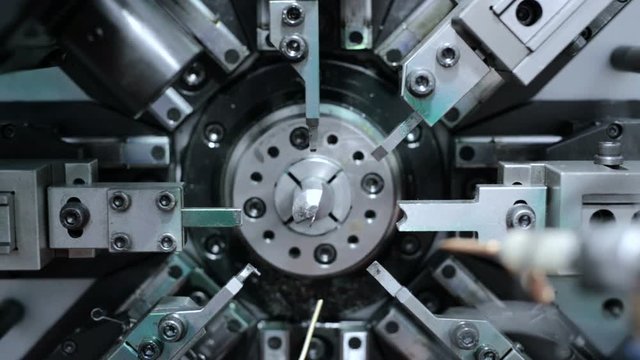 Automatic CNC bending machine. Manufacture of a spring of fine wire