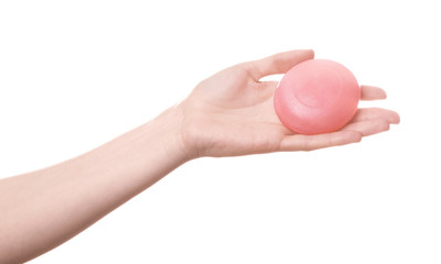 Female hand with soap for shower on white background