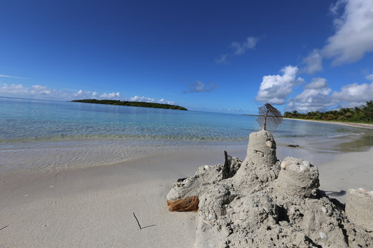 Caribbean beach with melted sand castle