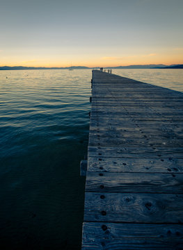 Wooden dock on Lake Tahoe at sunset