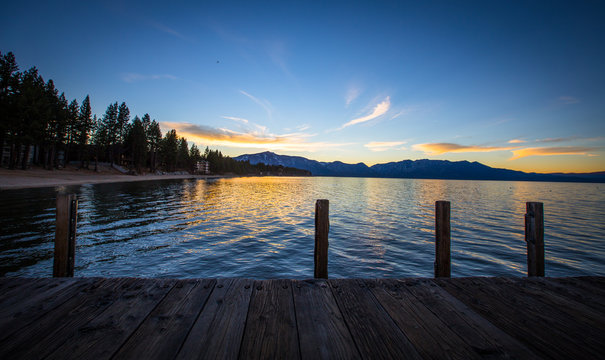 Sunset over Lake Tahoe water and boat dock