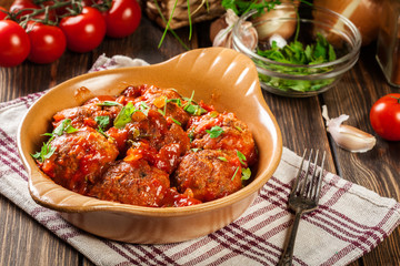 Pork meatballs with spicy tomato sauce in dish
