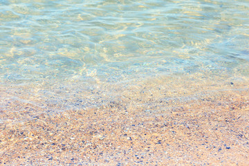 Warm sand and sea waves on beach