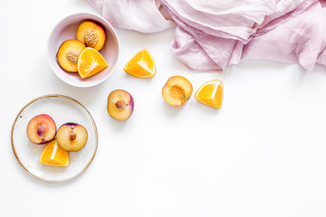 orange and peach summer sweet dessert on white background top view mock-up