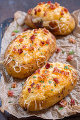 Baked stuffed potatoes with cheese and bacon