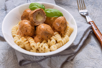 macaroni pasta with mozzarella stuffed meatballs