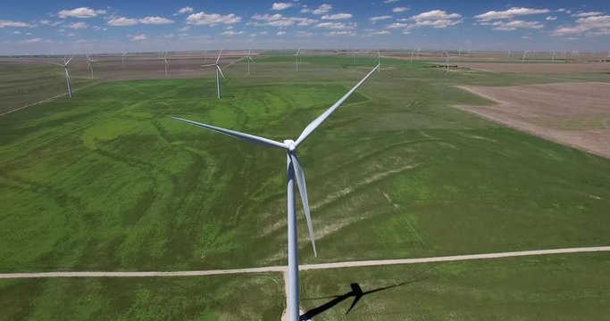 4K drone footage of turbines in wind farm (pan and tilt views)