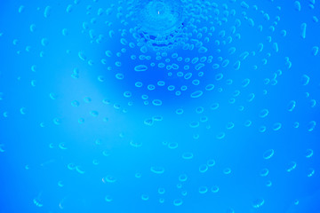 Air bubbles in blue water