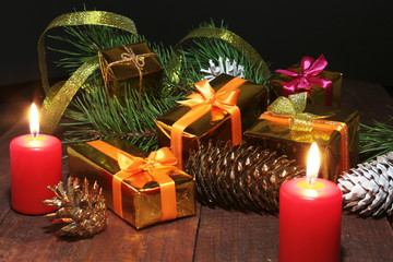 Celebration composition. Christmas candles and gift boxes.