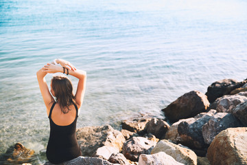 Young woman on background of sea or mountain lake.