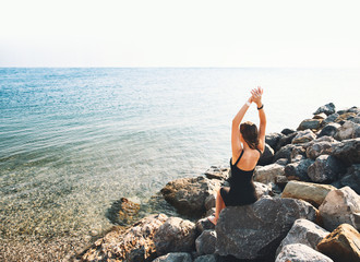 Young woman on background of sea or mountain lake.