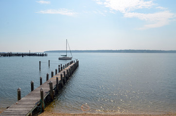 Large sailboat in coastal harbor 