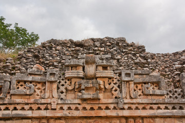 Fototapeta premium glyphs and mask in Yucatan ruins, Mexico
