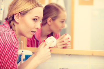 Woman applying moisturizing skin cream. Skincare.