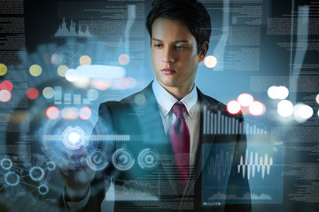 businessman looking at futuristic interface screen.