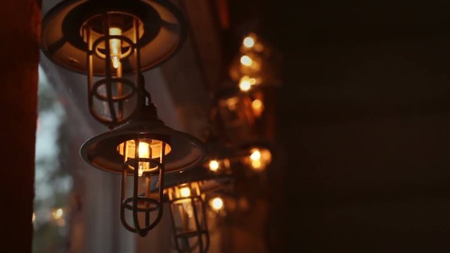 String lantern lights in inside of country cabin interior