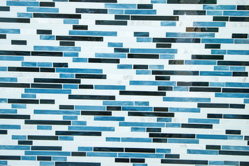 closeup of white brick wall with blue paint