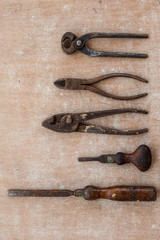 Old and Vintage carpenter tools on the old and dirty wood background