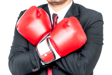 Businessman and boxing gloves isolated on white background