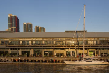 Foto auf Acrylglas Stadt am Wasser Jones Bay wharf in Sydney with skyscrapers in the background
