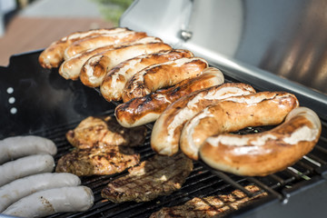 Barbecue grill bbq on propane gas grill steaks bratwurst sausages meat meal