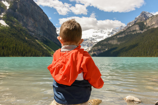 Little boy admiring the view at Lake Louise in Summer