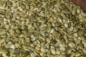 Vegan food. Raw pumpkin seeds for roasting closeup