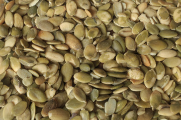 Vegan food. Raw pumpkin seeds for roasting closeup