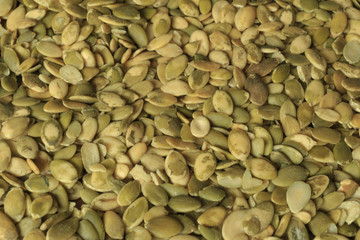 Vegan food. Raw pumpkin seeds for roasting closeup
