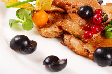 Turkey fillet stewed in a sauce with grapes