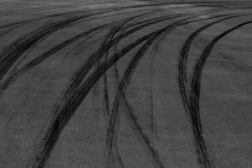 black tire tracks skid on asphalt road