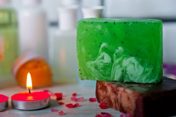 Bathroom accessories. Body care. Multi-colored natural soap, gels, shampoos, balms in vials, sea...