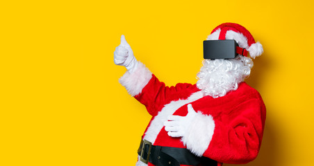 Funny Santa Claus have a joy with VR glasses