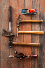 vintage old carpenter tool in the home industry on the old wood background 