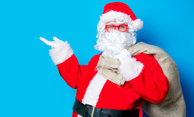 Fototapeta na wymiar Funny Santa Claus have a fun with red eyeglasses