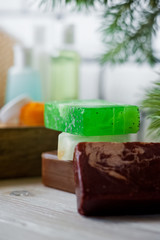 Bathroom accessories. Body care. Multi-colored natural soap, gels, shampoos, balms in vials, sea...