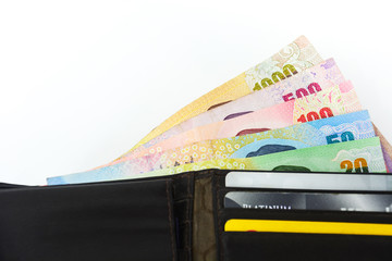 difference colors banknotes in leather wallet isolated on white background, copy space